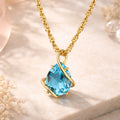 Damen Anhänger mit Kette aus 375er Gelbgold mit Blautopas - Singapurkette