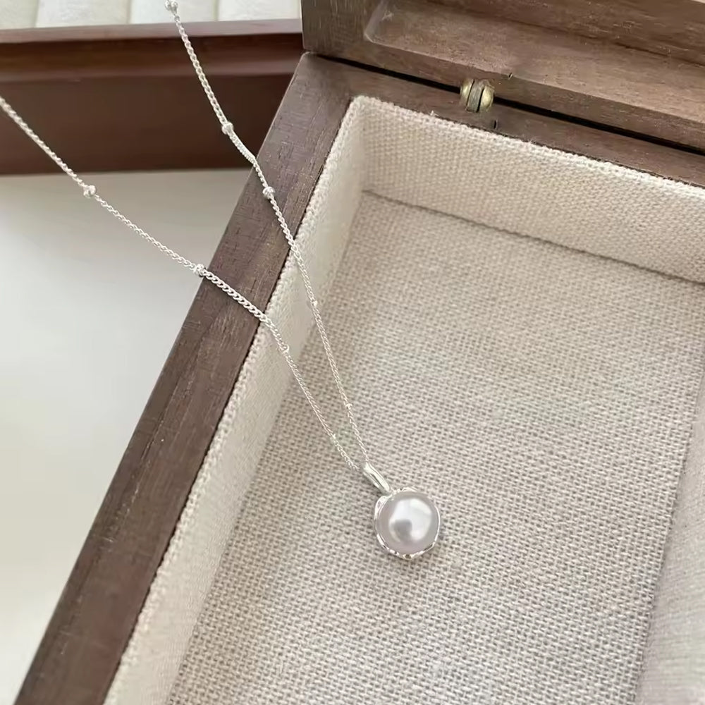 Kette mit Anhänger aus 925er Sterling-Silber, halbe Perle
