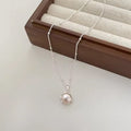 Kette mit Anhänger aus 925er Sterling-Silber, halbe Perle