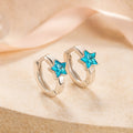 Silberne Kinder-Creolen mit blauem Stern-Zirkonia - moderner, funkelnder Schmuck für Mädchen.