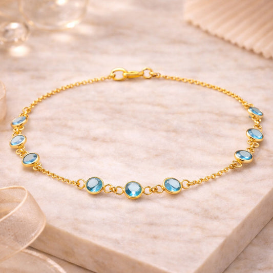 Vergoldetes 925 Silber Armband mit 9 blauen Zirkonia Steinen
